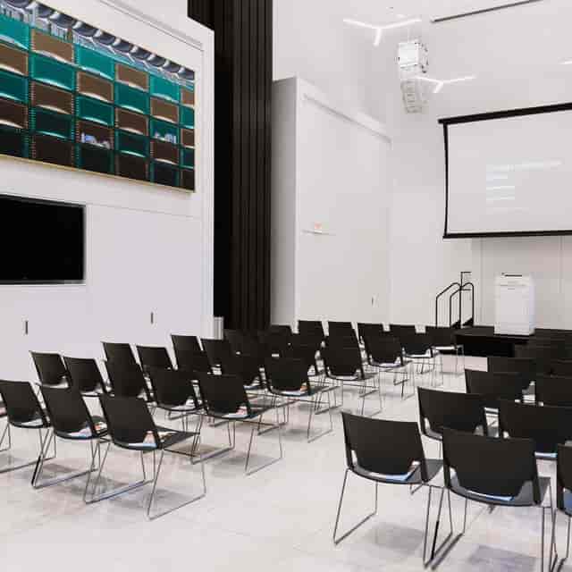 ArcelorMittal Design Studio event space with black chairs for presentations in Chicago.