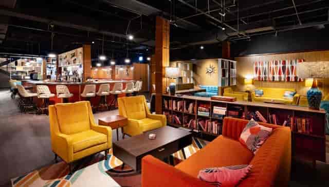 Vibrant iO Theater lounge with colorful seating for networking events and brainstorming.