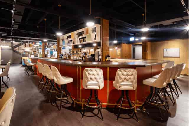 Stylish bar area in iO Theater, ideal for networking events and cocktail receptions.