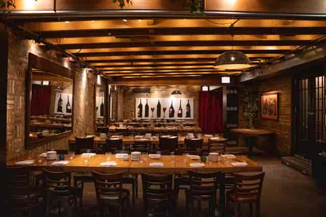 Event space at Cafe Ba-Ba-Reeba! with wooden table, ideal for intimate dinners and meetings.