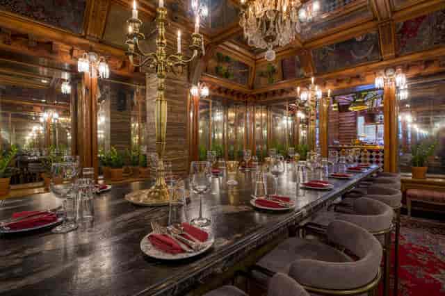 Elegant dining space with chandeliers for upscale events and private gatherings.