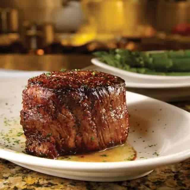Filet mignon with asparagus at Pappas Bros. Steakhouse, ideal for events and catering.