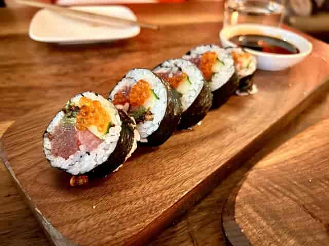 Private dining room with vibrant sushi platter for upscale events and catering.