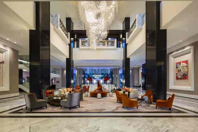 Post Oak Room at Willie G's: elegant hotel lobby with chandelier, ideal for events and meetings.