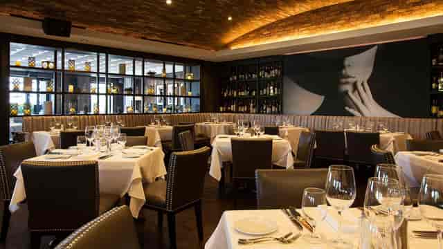 Elegant West Terrace Dining Room at Steak 48, perfect for upscale events and gatherings.