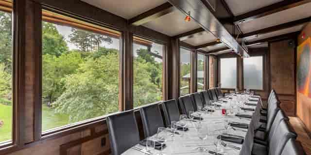 Private dining room at Brennan's of Houston with elegant table, ideal for corporate events.