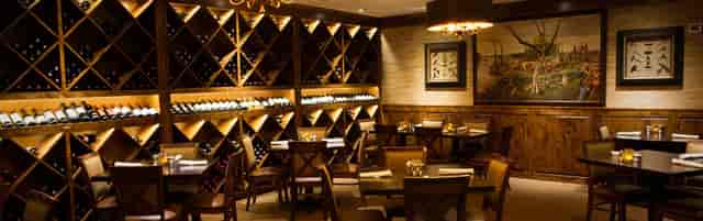 Sophisticated wine cellar dining area for intimate gatherings and tastings.