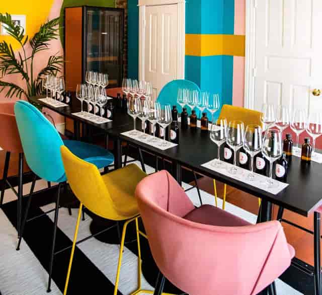 Elegant wine tasting setup in Taste of Texas with vibrant chairs and organized layout.
