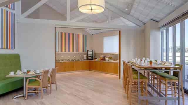 Modern meeting room at DoubleTree Houston, ideal for networking events and gatherings.