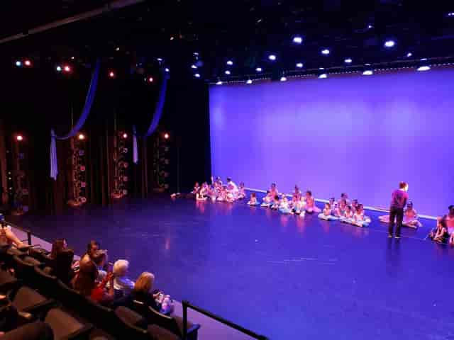 Well-lit stage in MATCH Theater 2, perfect for dance recitals and performances.