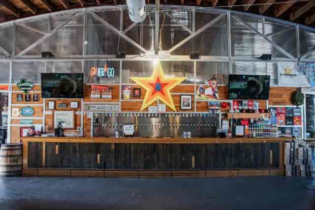 Vibrant brewery taproom with rustic decor, ideal for networking events and social gatherings.
