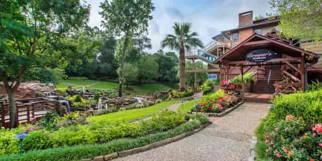 Lounge at Brenner's On The Bayou, lush outdoor venue for corporate events and retreats.