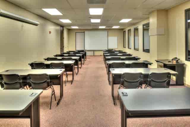 Grand Hall classroom setup with desks for training sessions and workshops at The Health Museum.
