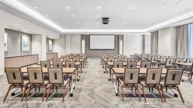 Main Event Room in The Houston Room, featuring a large screen for workshops and presentations.