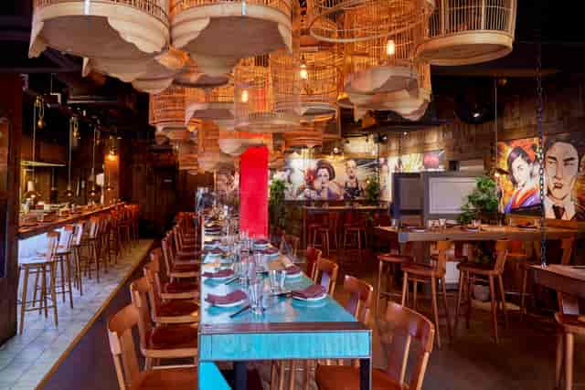Vibrant Yuu Kitchen event space with unique lights, ideal for gatherings and celebrations.