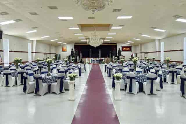 Elegant stage setup with navy blue decor, perfect for weddings and formal events.
