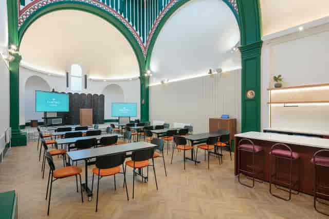 Versatile event space with modern design, ideal for networking and presentations.