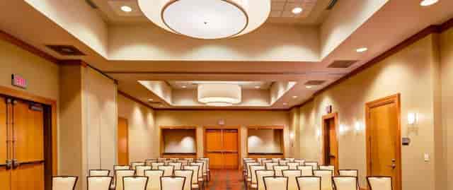 Conference room at Embassy Suites Houston, modern setup for presentations and workshops.