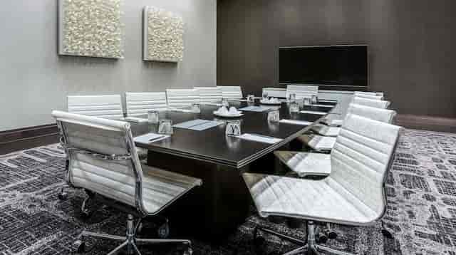 Modern conference room at Embassy Suites Houston for meetings and presentations.