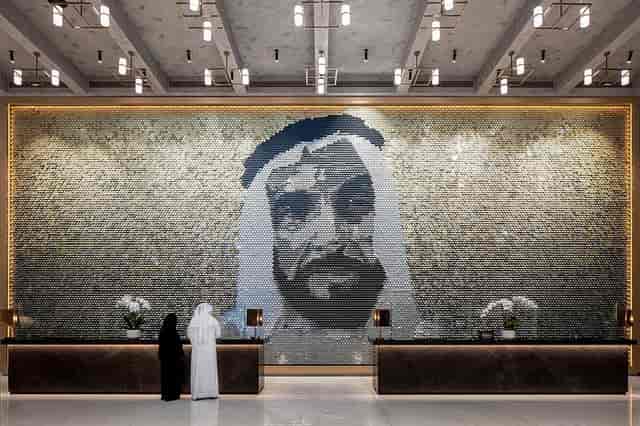Business center with mosaic wall at DoubleTree by Hilton Dubai, perfect for events.