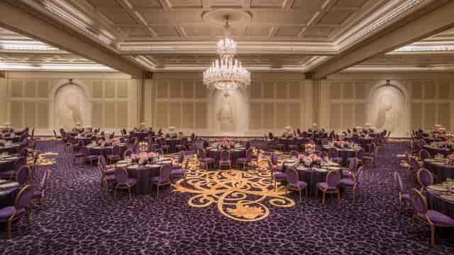 Elegant banquet hall with purple decor, perfect for upscale events in Dubai.