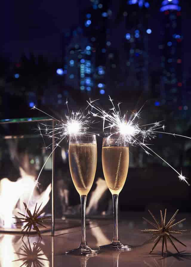 Champagne flutes with sparklers at One&Only Royal Mirage for elegant weddings and events.