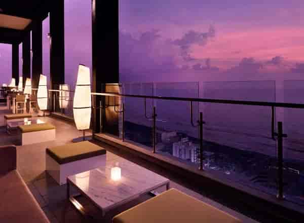 Rooftop terrace at Mövenpick Hotels, ocean view sunset venue for upscale events.