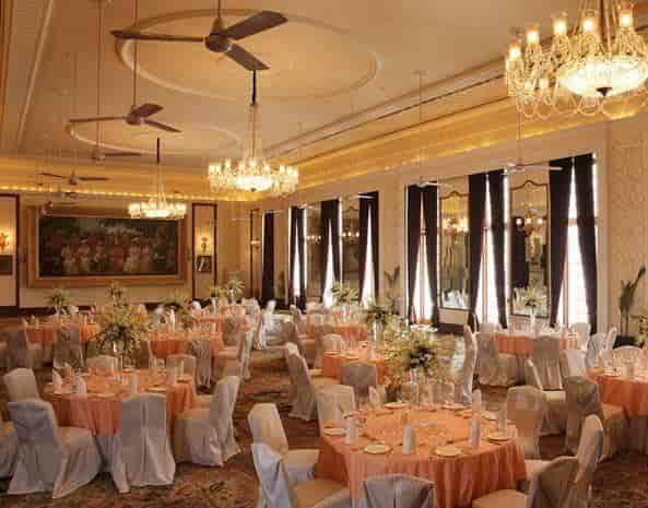 Elegant Royal Ballroom with orange decor, perfect for weddings and corporate events.