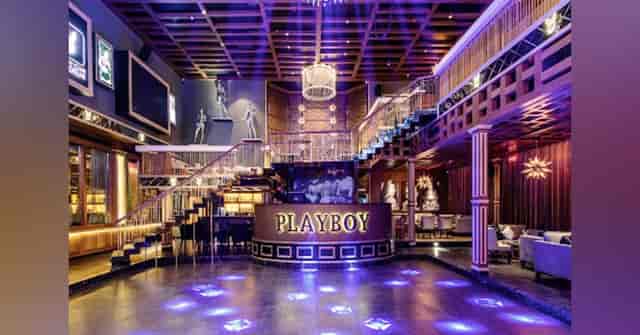 Elegant lounge with eye-catching staircase, perfect for upscale corporate events and private parties.