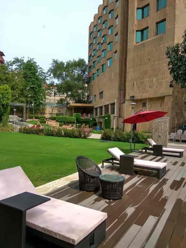 Lounge at Hotel Samrat, serene outdoor space with stylish chairs for networking events.