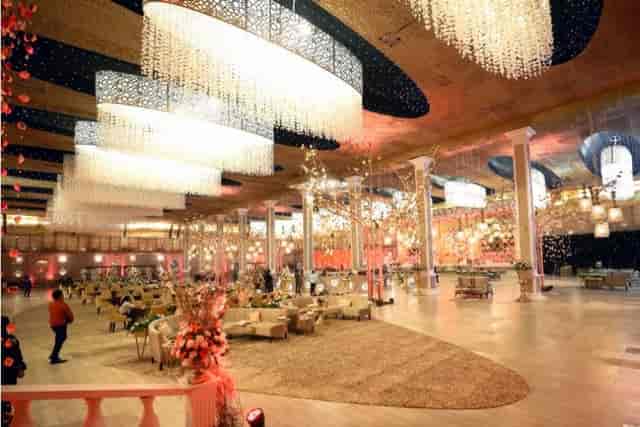 Elegant wedding lawn with chandeliers, perfect for upscale events and gatherings.