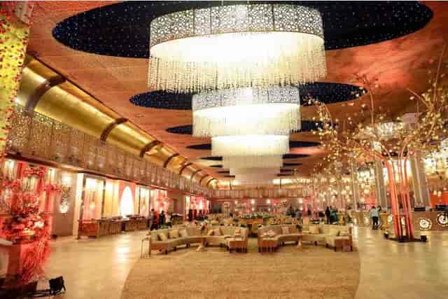 Luxurious wedding lawn with elegant chandeliers, perfect for high-profile events.