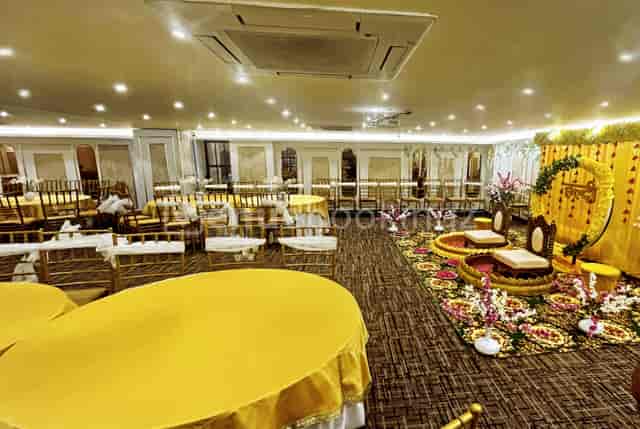 Elegant Banquet Hall with warm yellow decor, perfect for special events and celebrations.