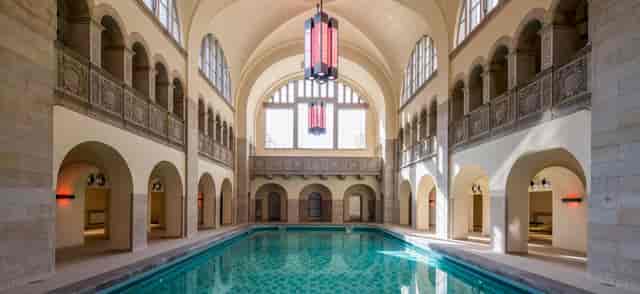 Elegant Stadtbad Oderberger suite with inviting pool, perfect for corporate retreats or wellness events.