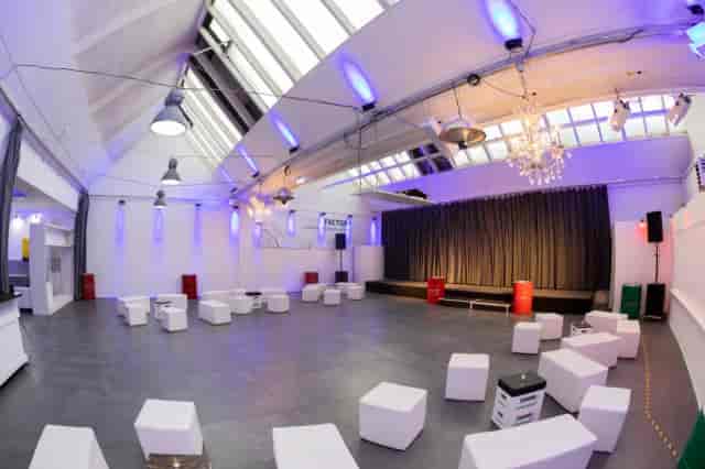Versatile event space in Forum Factory Berlin with high ceilings and modern decor.