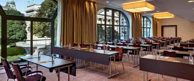 Banquet hall in Hilton Berlin, well-organized for corporate workshops and seminars.
