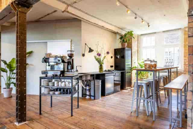 Modern break area with sleek coffee station for meetings and events in LAB 4.