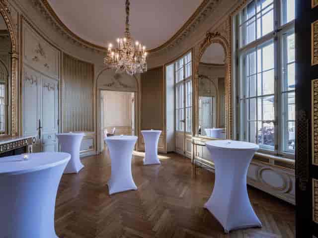 Elegant event space with tall windows for receptions at Schlosshotel Berlin.