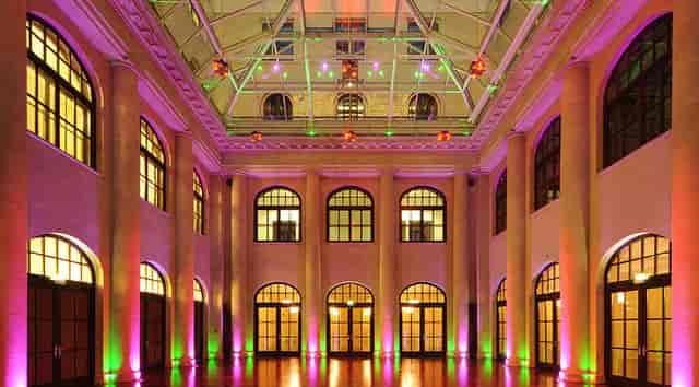 Caroline & Wilhelm von Humboldt in a vibrant, spacious event venue for corporate meetings or weddings.