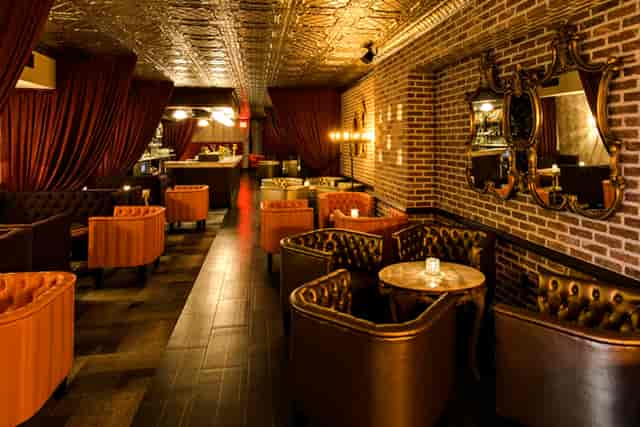 Stylish venue with plush seating for intimate gatherings and networking events.