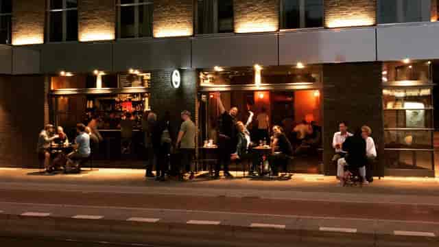 Vibrant bar in Berlin for networking events with indoor-outdoor seating.