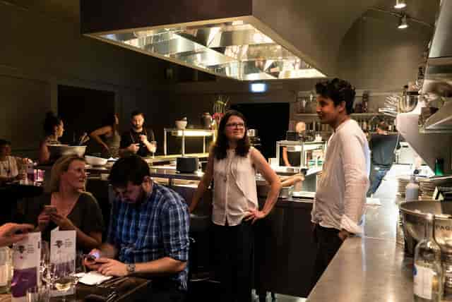 Lively Bar Tausend restaurant with open kitchen, ideal for events and culinary experiences.