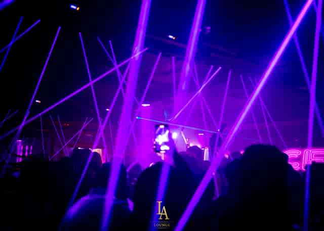 Vibrant LA Lounge nightlife with purple laser lights for corporate parties or celebrations.