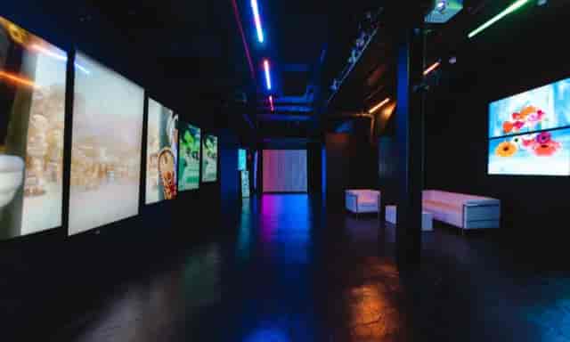 Modern Blackout Studio with vibrant lighting, ideal for corporate and creative events.