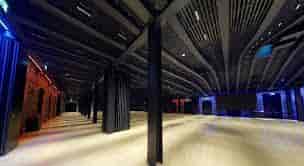 Modern event space in Villa Copenhagen with high ceilings for corporate conferences.