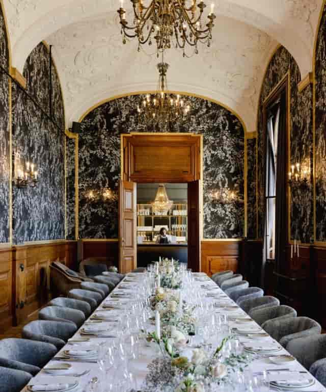 The Boardroom at Villa Copenhagen: luxurious meeting space with elegant dining table.