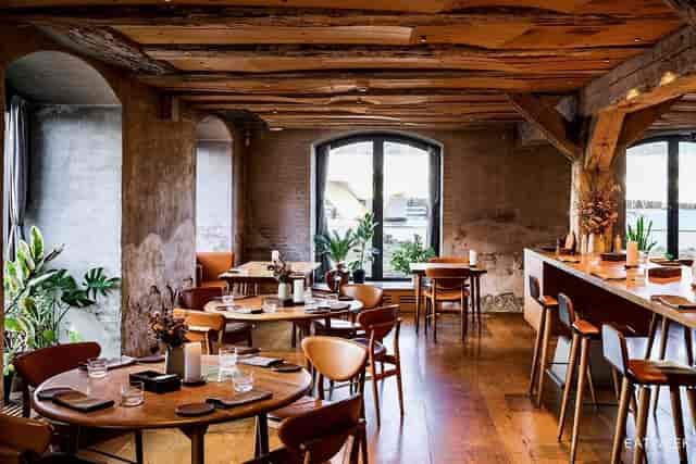 Private dining room with rustic beams, ideal for intimate dinners or corporate retreats.