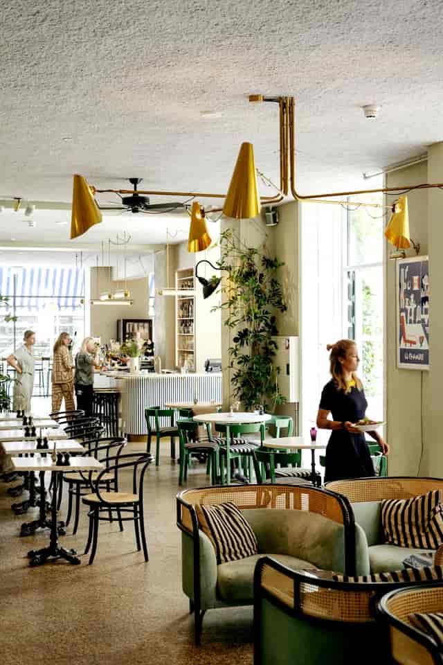 Modern Coco Café in Coco Hotel, perfect for meetings and casual events with greenery.