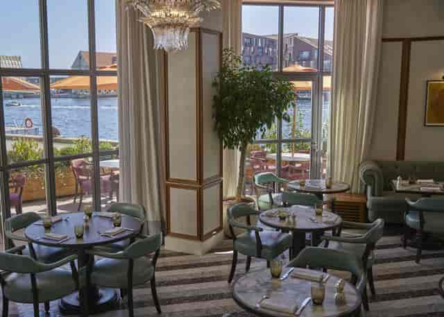 Stylish SOHO private party dining area with waterfront views, perfect for networking events.