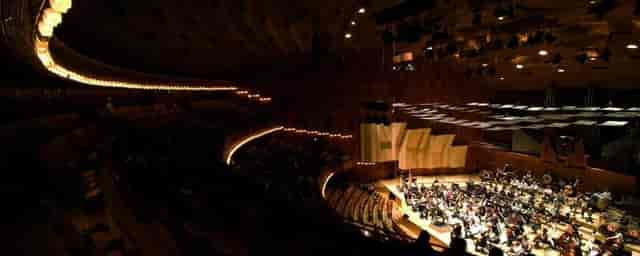 Elegant concert hall with tiered seating for memorable events at Royal Danish Academy.